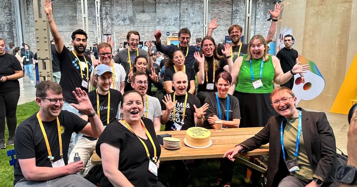 The MDN team and partners celebrate with cake in Berlin